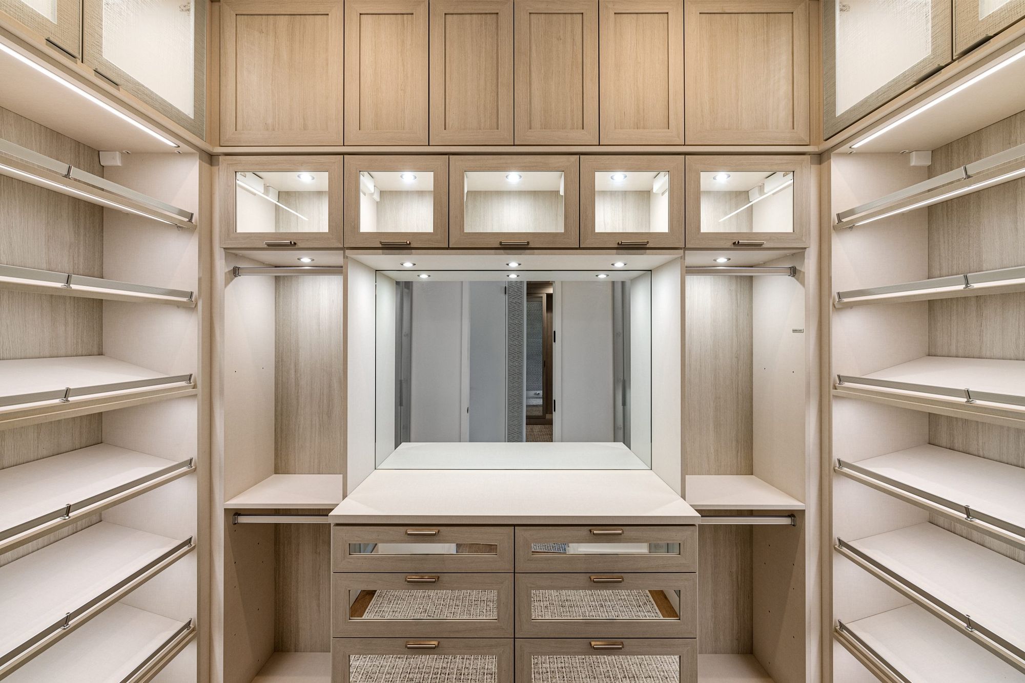 Walk-in dressing room with sensor-lit wardrobe fit-out in Yorkville